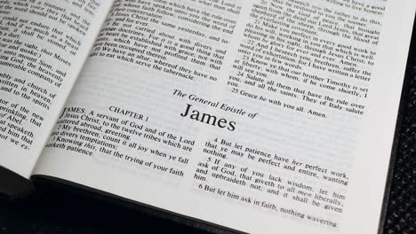 Close-Up-Shot-of-Bible-Page-Turning-to-the-book-of-James