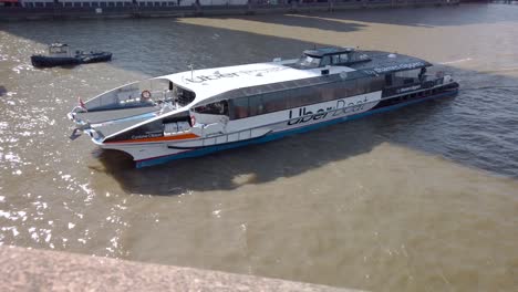 Passanger-Cruise-Boat-"Uber-Boat"-on-River-Thames,-London-Tourist-Transportation