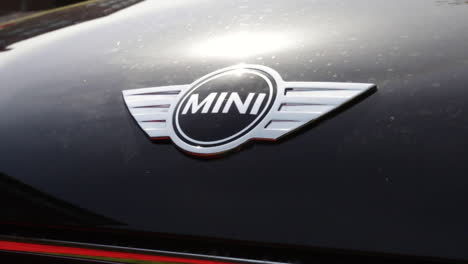 Close-up-of-a-Mini-logo-on-a-car
