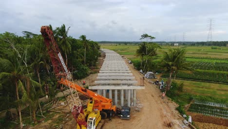 Antena,-Pilares-De-Hormigón-En-El-Sitio-De-Construcción-Del-Monorraíl-En-Yogyakarta,-Indonesia