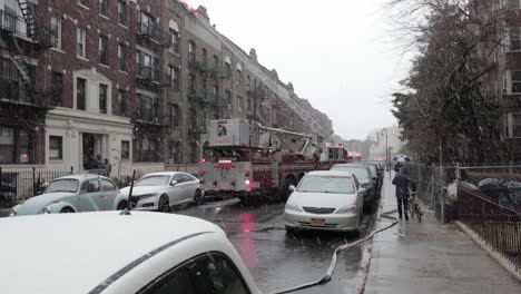 Firetruck-clogging-up-Brooklyn-residential-block-assisting-ConEd-fire-accident-under-heavy-snow---wide-shot