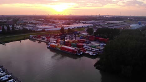 Orange-Yellow-Sunset-Over-Cargo-Container-Transfer-Facility-In-Ridderkerk