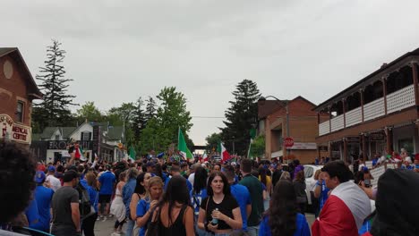 Handheld-Shot-Walking-through-Excited-Crowd-of-Italian-Football-Fans-in-Woodbridge,-Toronto