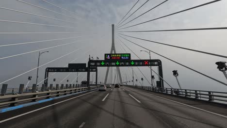 Driving-on-Incheon-Bridge-over-the-ocean-water-to-Yeongjong-Island---driver-point-of-view