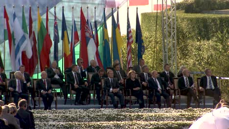 German-Chancellor-Angela-Merkel,-Russian-Prime-Minister-Vladimir-Putin,-and-20-other-European-leaders-on-the-main-ceremony-to-commemorate-the-start-of-WWII-hosted-by-Polish-President-Lech-Kaczynski