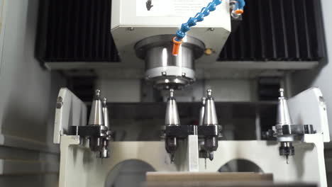 CNC-machine-detaching-an-ejectable-drill,-putting-it-into-a-tool-rack