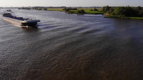 Aerial-View-Goudvis-Inland-Freighter-Ship-Traveliing-Along-Oude-Maas