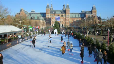 Dutch-People-Skating-In-An-Outdoor-Ice-Rink-With-Rijksmuseum-In-Background