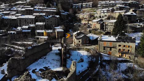 Aerial:-snowy-mountain-town-on-a-mountain-slope-in-the-catalan-pyrenees