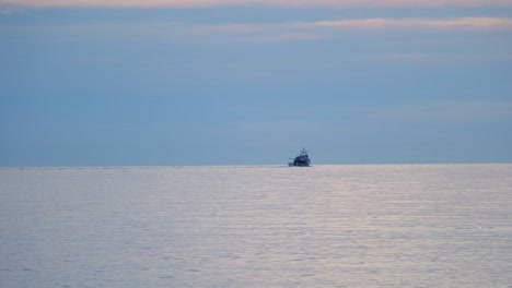 Sea-Horizon-With-Cargo-Ship-Silhouette---wide