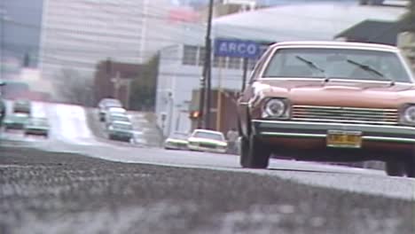 PULL-FOCUS-ON-OLD-CARS-ON-THE-ROAD-FROM-1983
