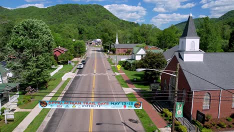 aerial-of-small-town-damascus-virginia-along-the-creeper-trail,-churches-in-town