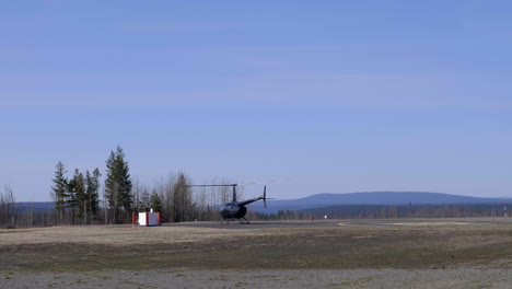 Black-Helicopter-Takes-Off-From-Williams-Lake-Airport-In-British-Columbia,-Canada