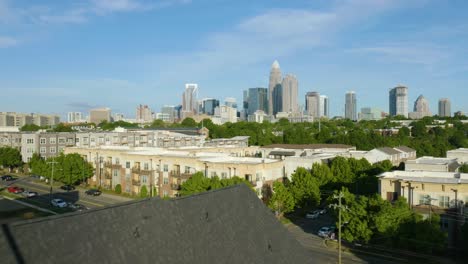 Drone-Flies-Past-New-Home-being-Built-with-Charlotte-Skyline-in-Background