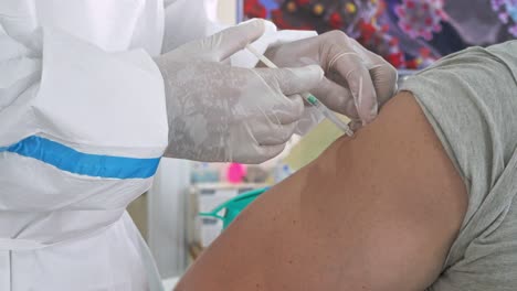 Person-Getting-Covid-19-Or-Flu-Vaccine-At-The-Hospital-In-Phnom-Penh,-Cambodia---Vaccination,-Immunization,-Disease-Prevention-Concept---close-up