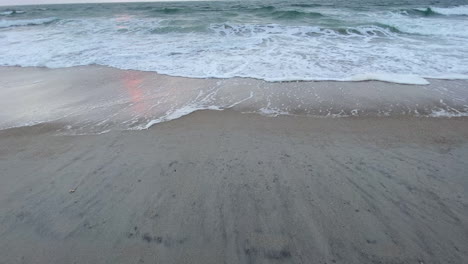 Ocean-Waves-Coming-Into-Sandy-Shore-Of-Beach