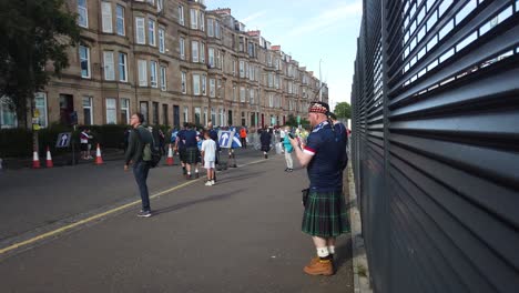 A-Scottish-fan-in-a-kilt-waits-for-friends-before-the-Euro-2020-group-match-against-Croatia-at-Hampden-Park