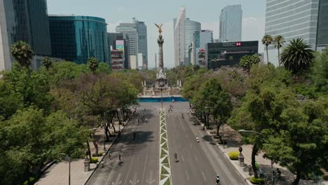 Aerial-wide-angle-of-paseo-de-la-reforma-street-with-cyclists-at-road