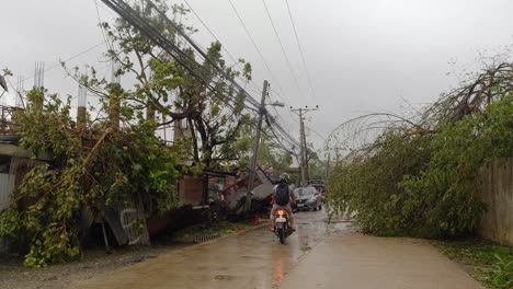 Broken-trees-partially-block-the-road-after-Typhoon-Rai-hit-Cebu-City