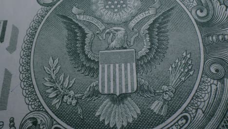 Close-Up-Pan-Right-of-the-Great-Seal-on-the-Back-of-a-US-One-Dollar-Bill