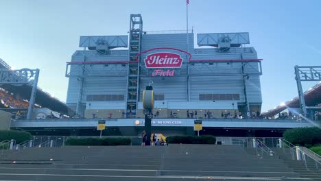 Panoramic-view-of-Heinz-Field,-home-of-the-Pittsburgh-Steelers-in-Pittsburgh,-PA-during-dusk-sunset