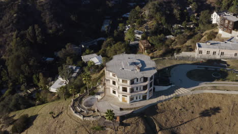 Aerial-over-creepy-derelict-Hollywood-Hills-mansion-in-California