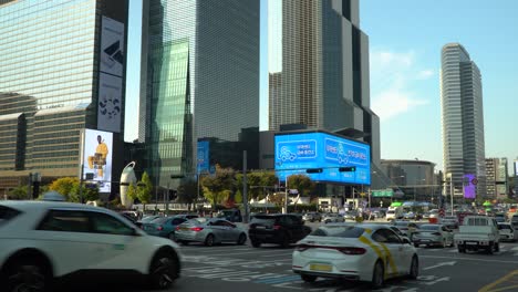 World-Trade-Center-Seoul---Cars-Traffic-Passing-Samseong-Subway-Station-Crossroads-on-the-Widest-Multilane-Road-near-Coex-Trade-Tower-and-Parnas-Tower-on-Sunset-in-Autumn