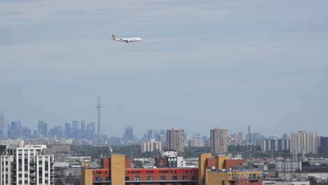 An-airplane-flying-over-the-beautiful-cityscape-of-Ontario