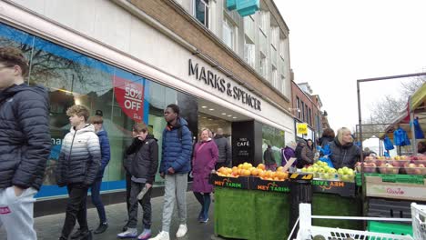 People-Walking-past-fruit-and-veg-market-stall-outside-Marks-and-spencer-St-Albans