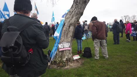 A-person-stands-in-front-of-the-camera-at-a-Scottish-Independence-rally