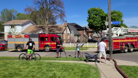 House-fire-alert,-Toronto's-firefighters-and-neighborhood-in-dangerous-shot-in-movement