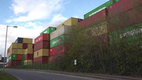 Shipping-container-are-stacked-up-in-a-large-holding-facility-at-the-Port-of-Felixstowe,-Suffolk,-UK