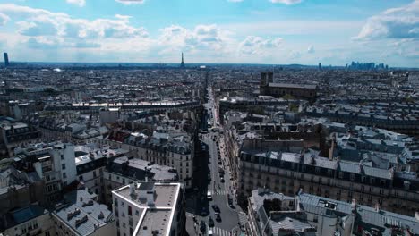 Paris-aerial-view-of-city,-flying-forward-above-street-with-Eiffel-Tower