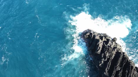 Top-down-drone-footage-of-waves-and-rocks-at-the-Cap-Mechant-on-the-Reunion-island