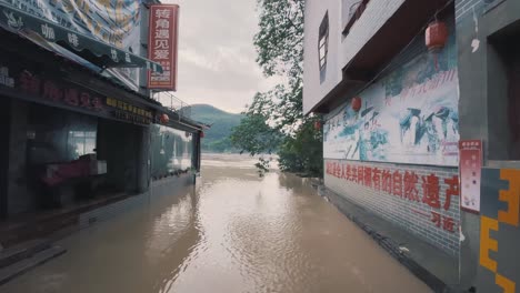 Flooded-Street-in-China,-River-Floods-in-City,-Water-Damage-for-Stores