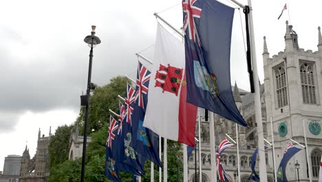 Row-Of-Commonwealth-Flags-Fluttering-In-Wind-At-Parliament-Square-In-Westminster