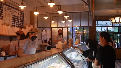 Yogyakarta,-Indonesia---June-17,-2022-:-People-buying-ice-cream-inside-Tempo-Gelato-outlet-in-Yogyakarta