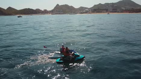 People-enjoying-a-jet-ski-ride-in-the-sea-near-Cabo-San-Lucas