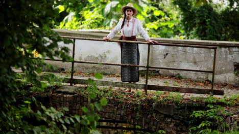 Romanian-girl-admires-the-stream-from-the-middle-of-the-old-bridge-2