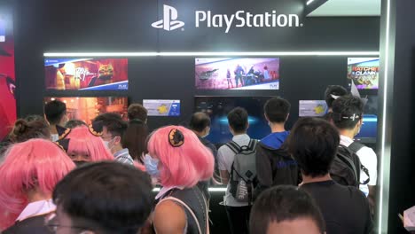 Visitors-are-seen-at-the-booth-from-the-Japanese-video-gaming-brand-owned-by-Sony-Computer-Entertainment,-PlayStation-5-,-system-during-the-Ani-com-and-Games-ACGHK-exhibition-event-in-Hong-Kong