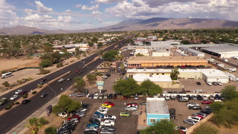 Drone-flight-over-car-dealership-and-businesses-in-East-Tucson,-Arizona