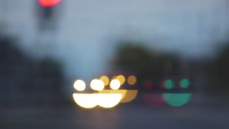 Colorful-smiley-face-emoji-bokeh-from-moving-car-and-traffic-lights-at-the-evening,-social-media-emoji-background-concept