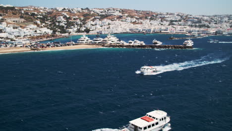 Cruise-Ship-Tender-Boats-on-Bay-in-Mykonos-Town,-Greece-on-Sunny-Day