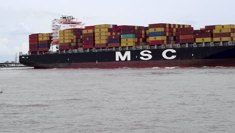 Fully-loaded-cargo-ship-moves-down-the-Mississippi-River-past-the-port-of-New-Orleans