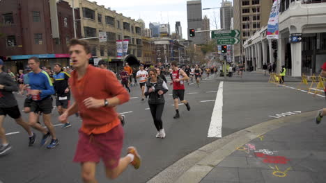 Last-half-of-first-wave-of-seeded-red-runners-at-start-of-race-running-up-William-street
