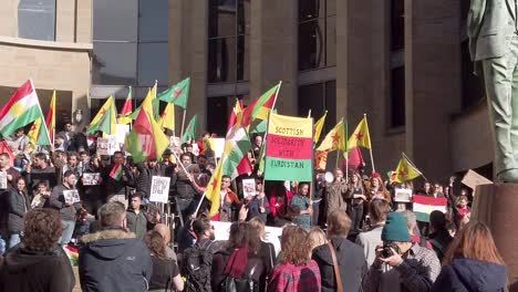 Wide-shot-of-slow-motion-of-people-protesting-against-the-Turkish-occupation-and-ethnic-cleansing-of-the-Kurds-in-Glasgow
