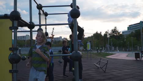 Young-Boys-Practicing-Parkour-In-A-Park-In-The-City-Of-Cluj,-Napoca,-Romania---Wide-Shot