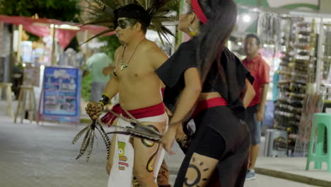 Mexican-indigenous-dancing-for-tourists-at-Playa-del-Carmen,-Mexico