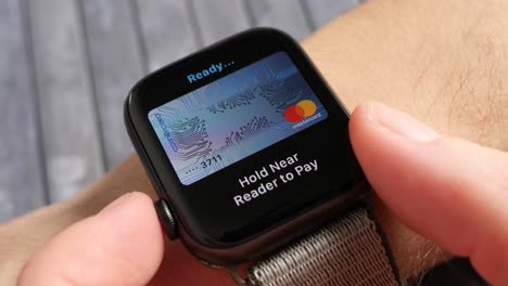 Paying-with-apple-watch,-apple-pay-being-used-by-a-person