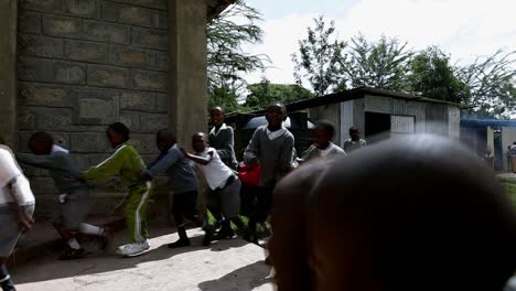 Happy-young-children-in-school-uniforms-line-up-and-walk-into-church-building-on-the-grounds-of-their-private-school-near-Nairobi
